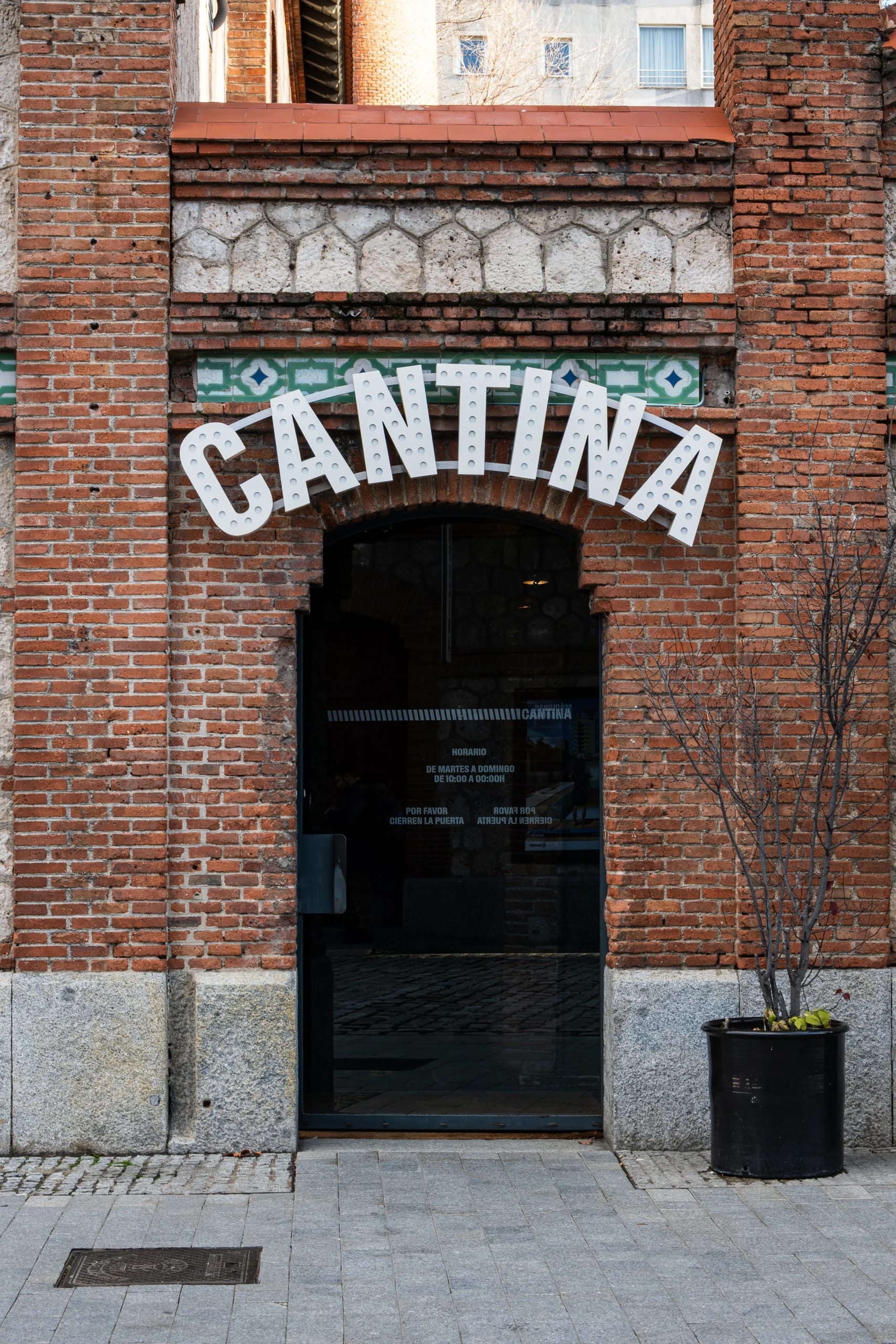 Cantina entrance within a brick facade