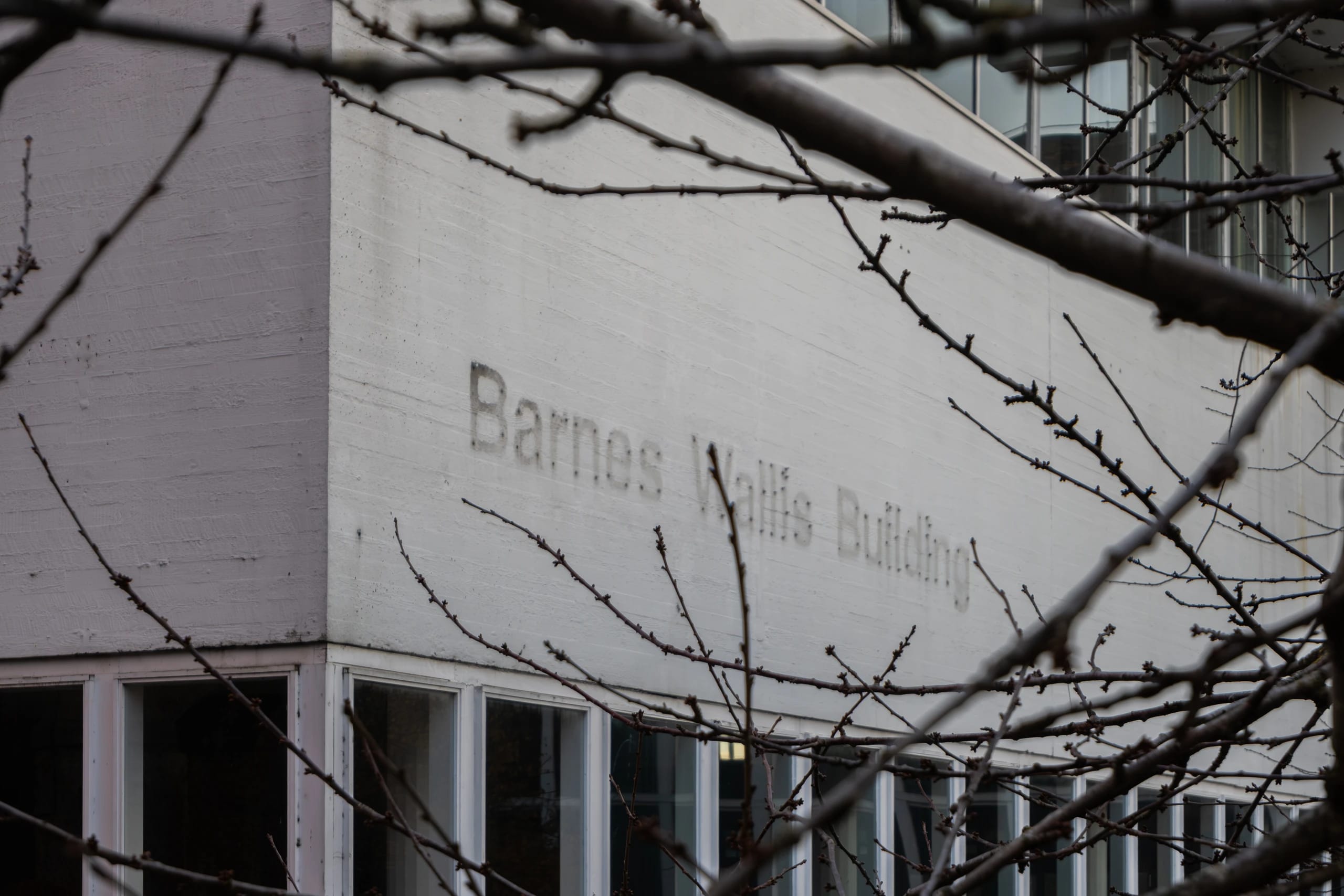 The Barnes Wallis Building framed by bare branches