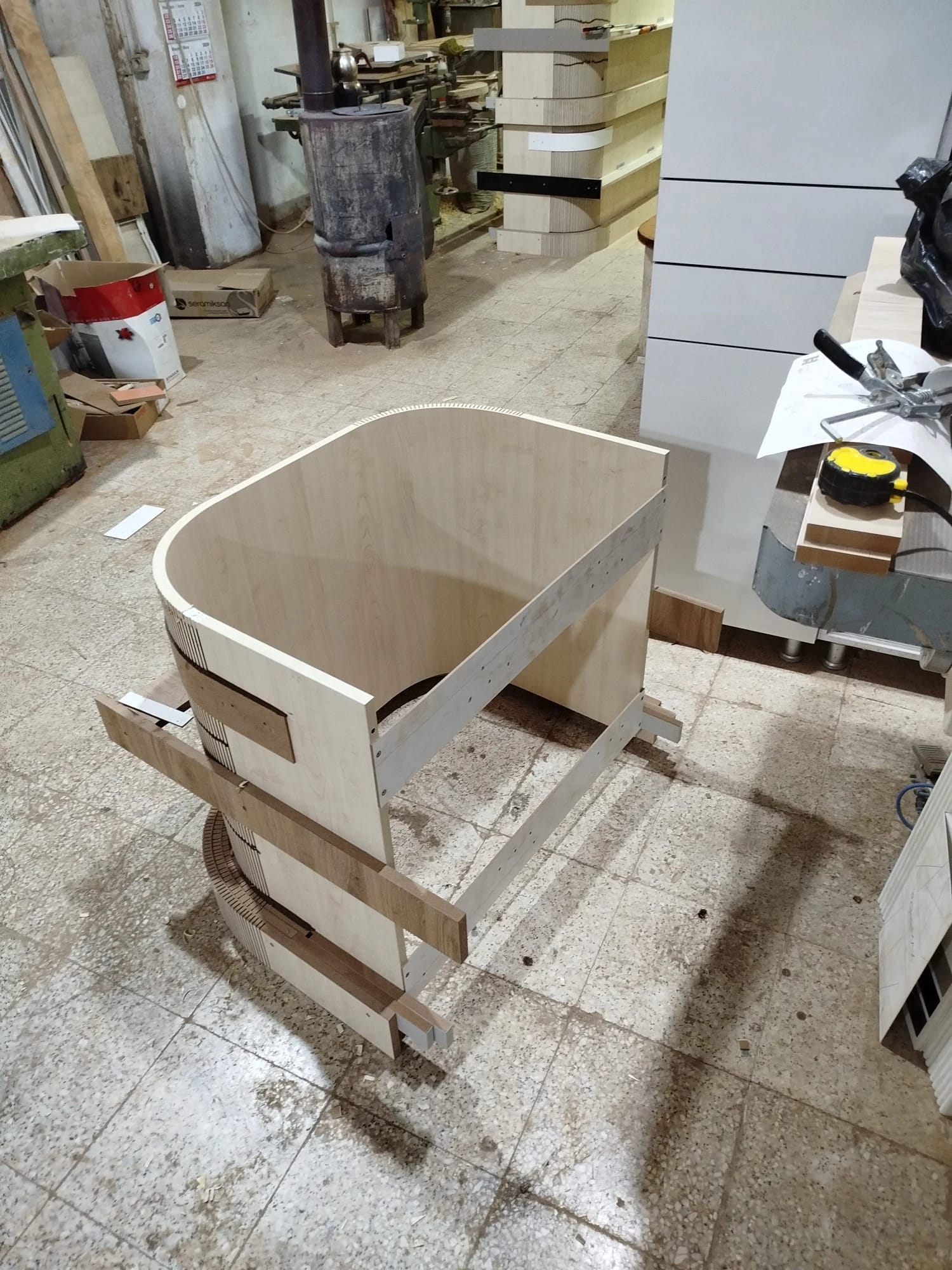 Fabricating the curved timber niches.