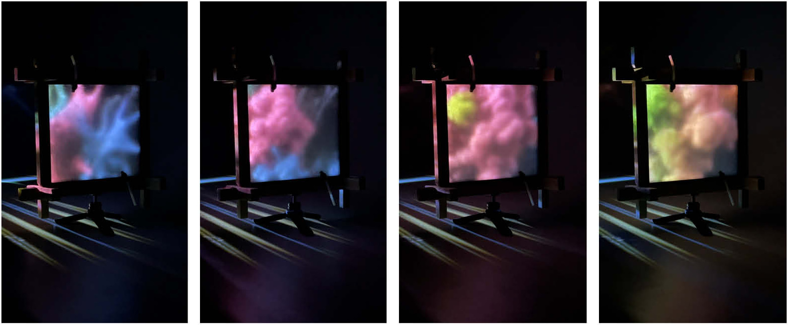 Four night photographs of the aerogel ETFE prototype in its timber frame with coloured cloud-like projections glowing through the cushion.